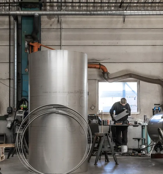 Welder working on tube system