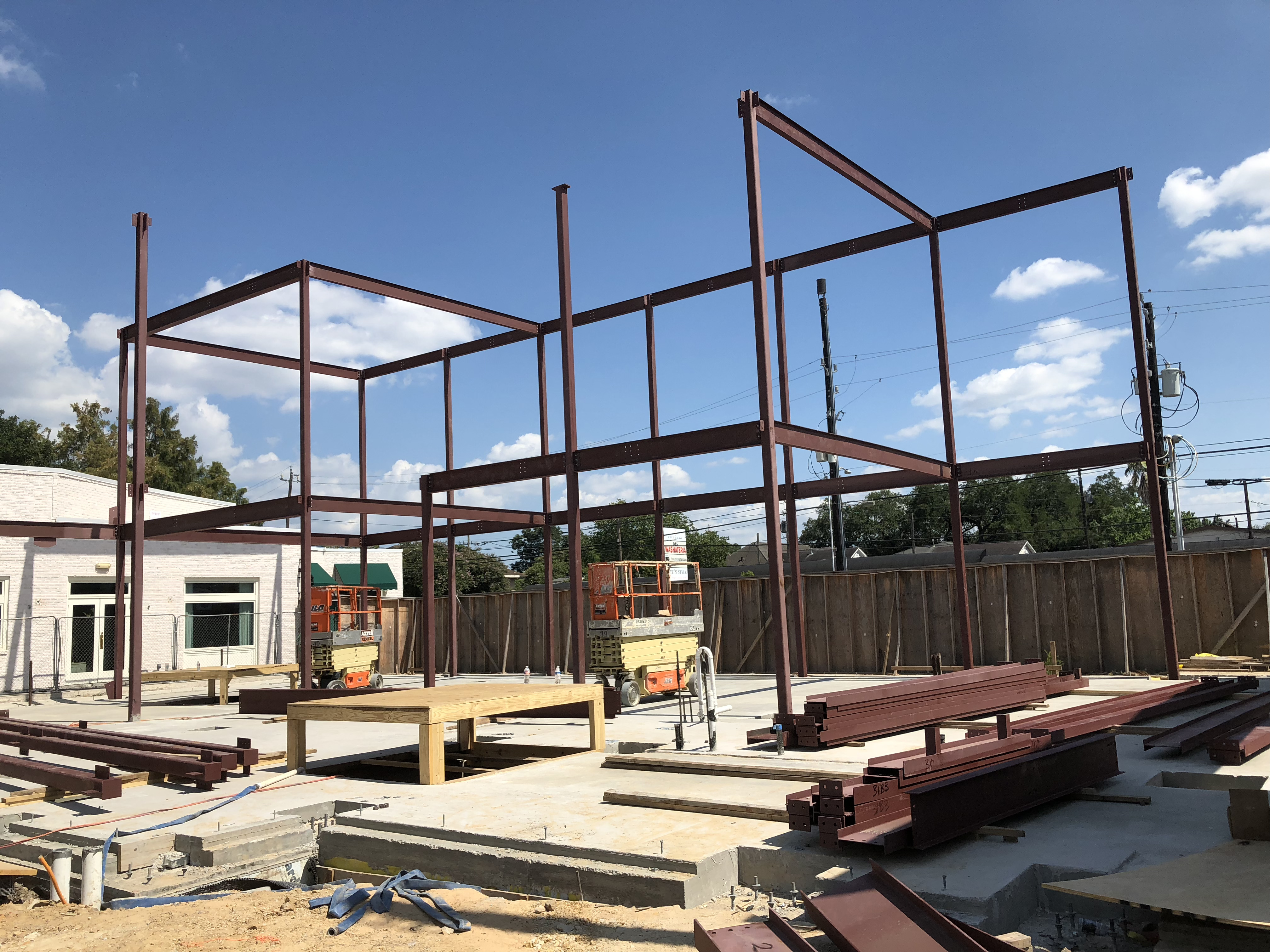 Worker grinding heavy structure