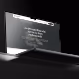 Laptop screen displaying the text 'On-Demand Financial Advice for Busy Professionals' on a dark background.