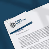 Letterhead featuring Birch Financial logo with business stationery on a desk.