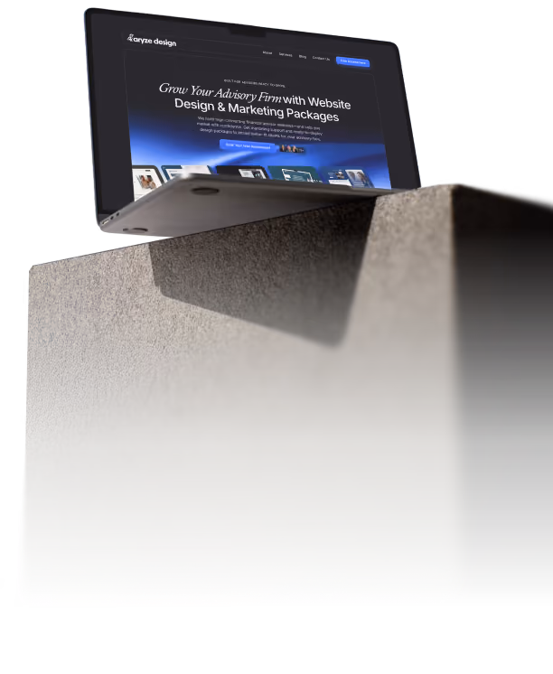 Laptop angled upward with screen showing advisory firm website design and marketing packages.