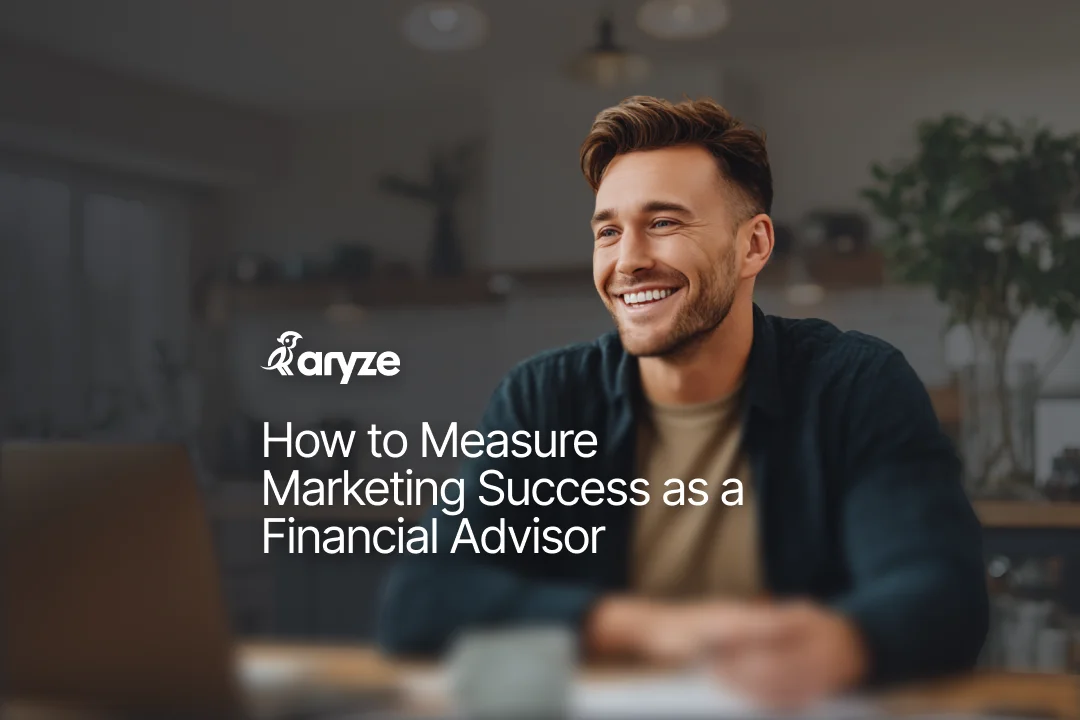 Smilling financial advisor sitting at his desk infront of his laptop