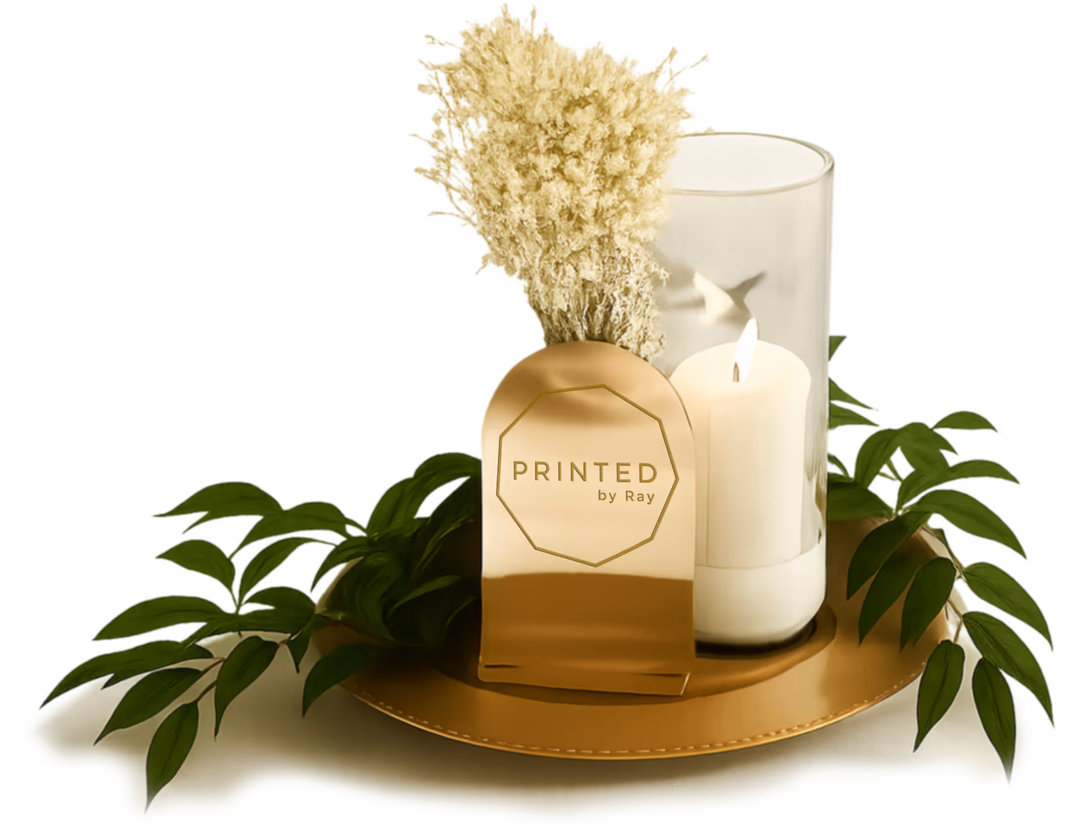 Gold tray with a lit white candle in a glass holder, dried flowers, green leaves, and a gold plaque reading 'PRINTED by Ray'.
