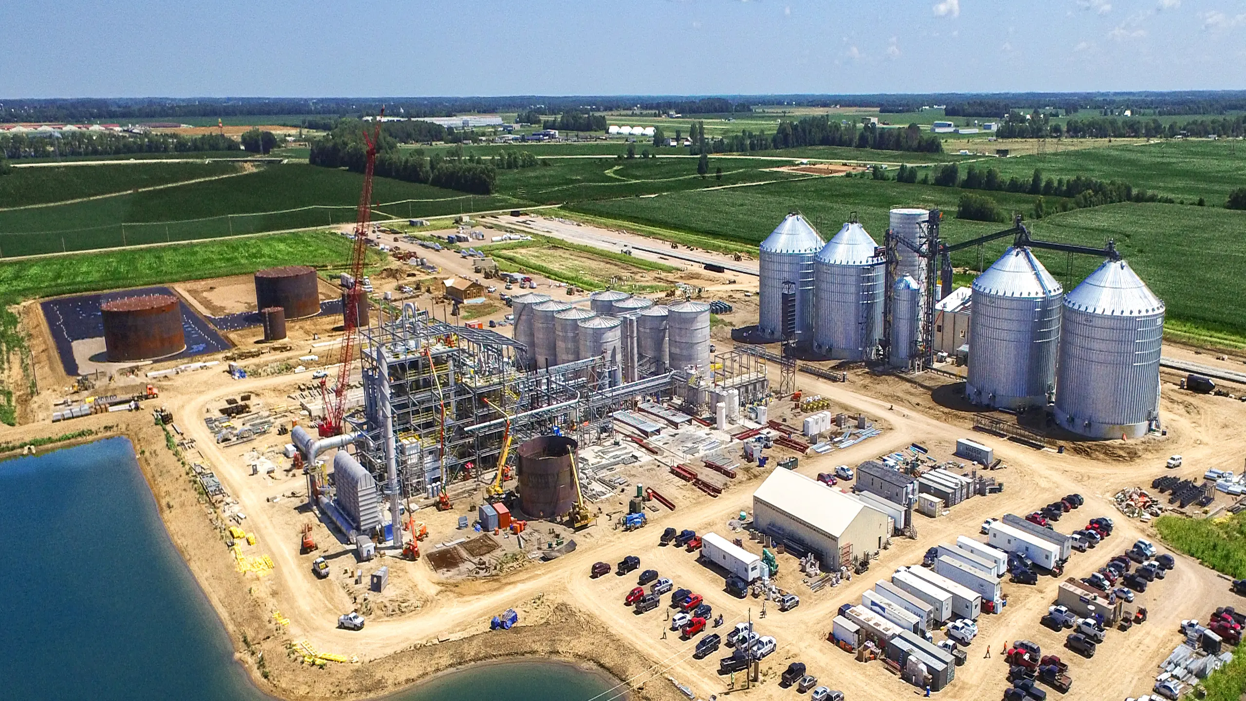 Industrial site with silos and cranes