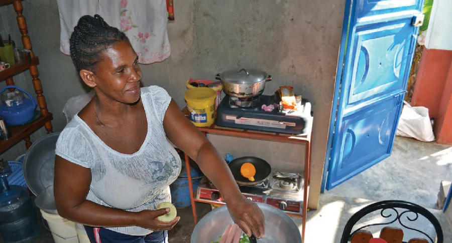 A woman cooking in a kitchen