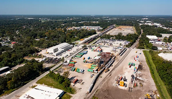 Aerial view of a freight yard with containers.
