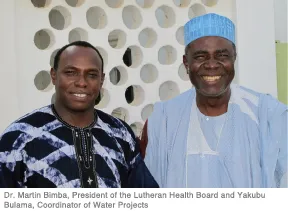 Dr. Martin and Yakubu smiling at the camera