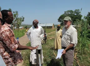 Four people talking in a farm