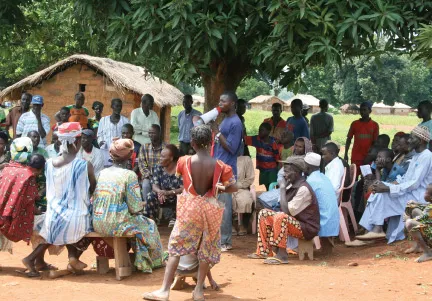 A group of people sitting outside