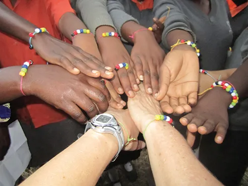 Diverse hands joined in a circle