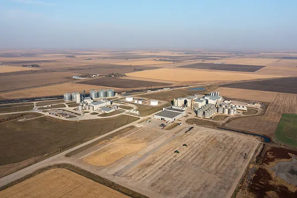 Aerial view of grain silos and farm buildings.