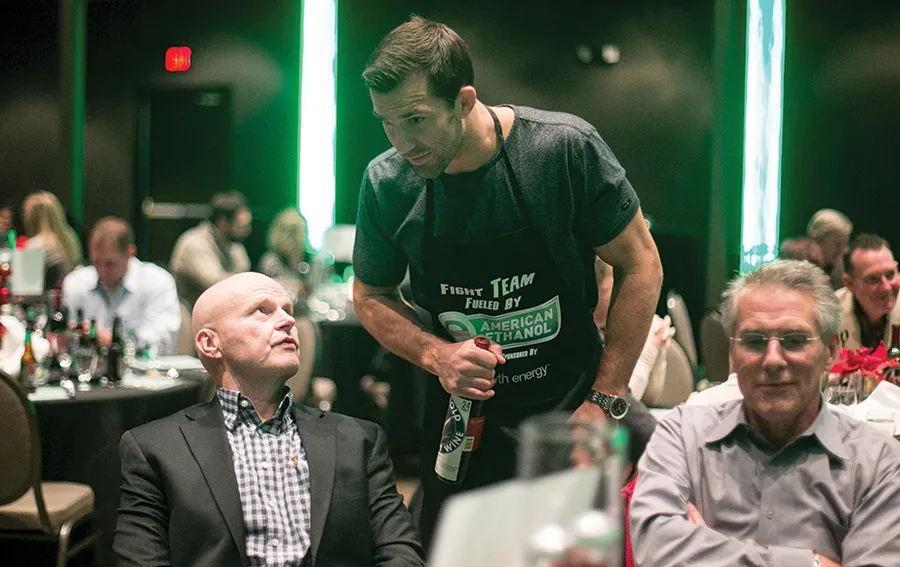 Luke Rockhold sells his custom-labeled wine to Dine with a Fighter attendees.