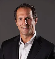 Greg Breukelman headshot smiling at the camera