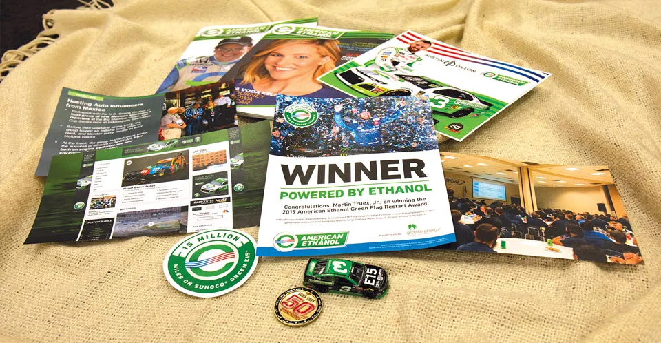 WINNER magazine with racing brochures on burlap.