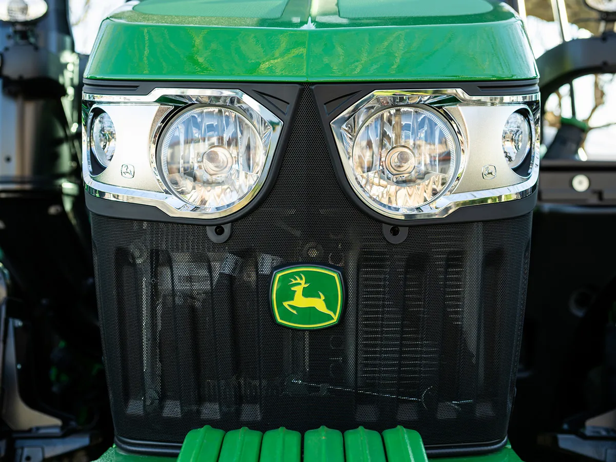 Front view of a green John Deere tractor.