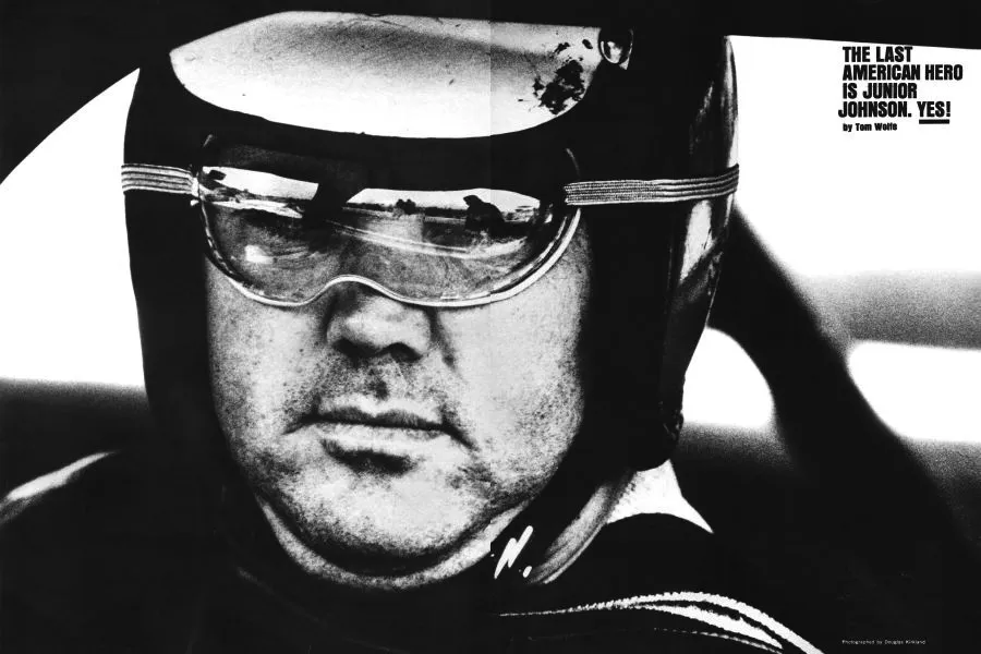 Junior wearing helmet and goggles in his car