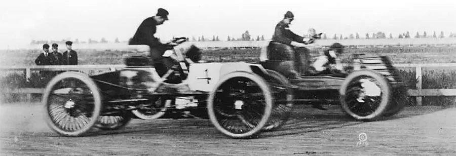 Two vintage race cars on track