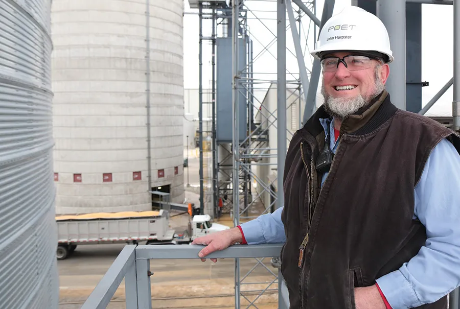 John in hard hat at industrial site