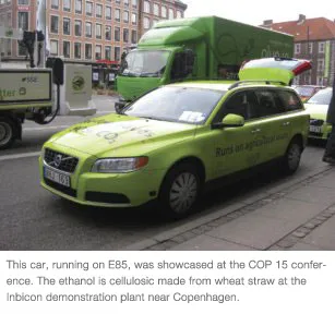 A green car parked on the street