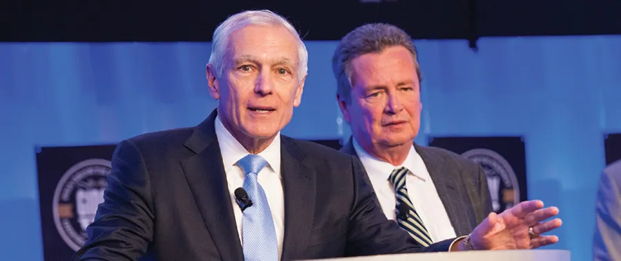 General Wesley Clark and Tom Buis sitting at a desk