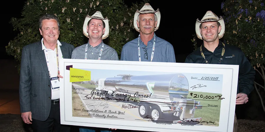 Tom Buis, Jack Rogers , Dave Kramer and Tom Kortuem holding a big cheque
