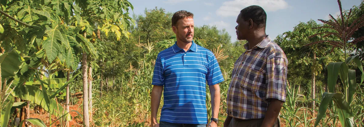 Jeff Broin talks with the headmaster at Kakuswi School