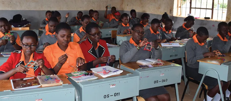 Students making crafts together in a classroom