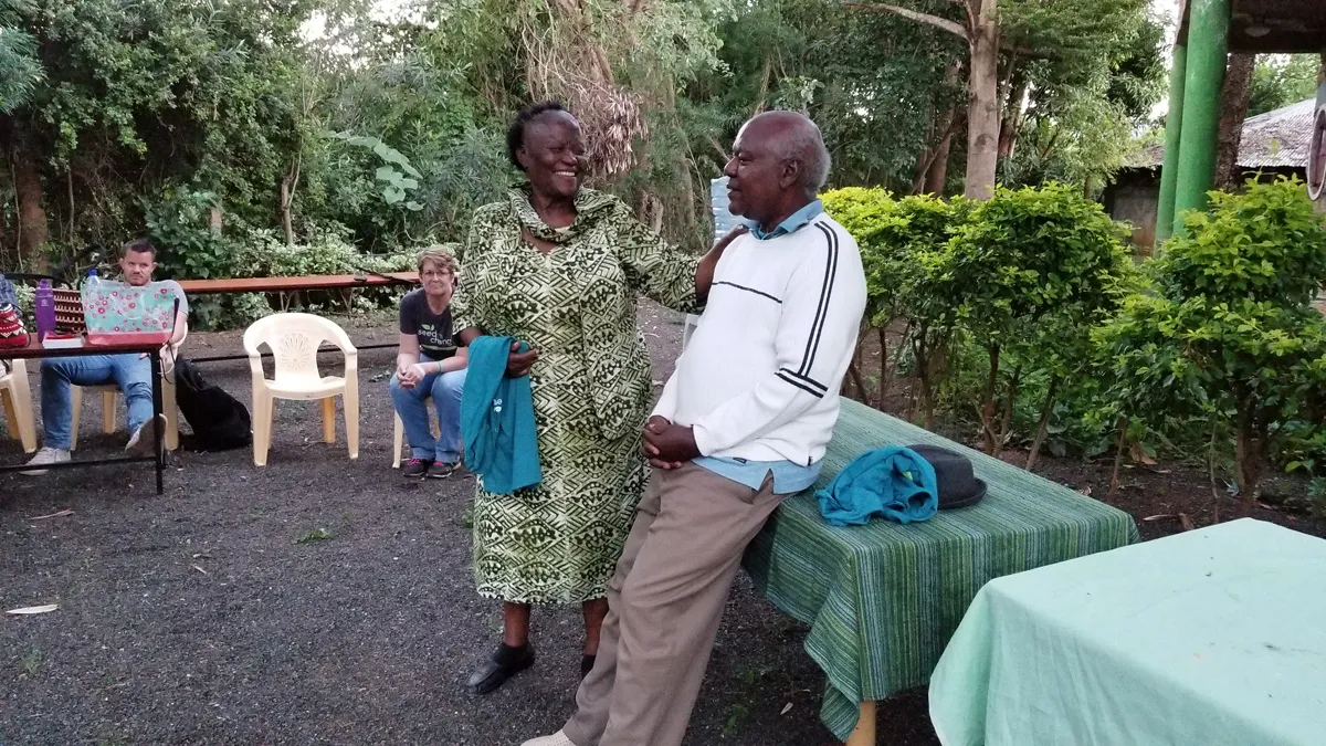 Esther and Shadrack standing outside