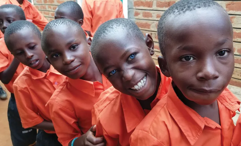 Kakuswi students line up for an afternoon snack.