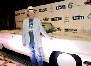 Neil Young poses with his LincVolt at the Hard Rock Hotel & Casino