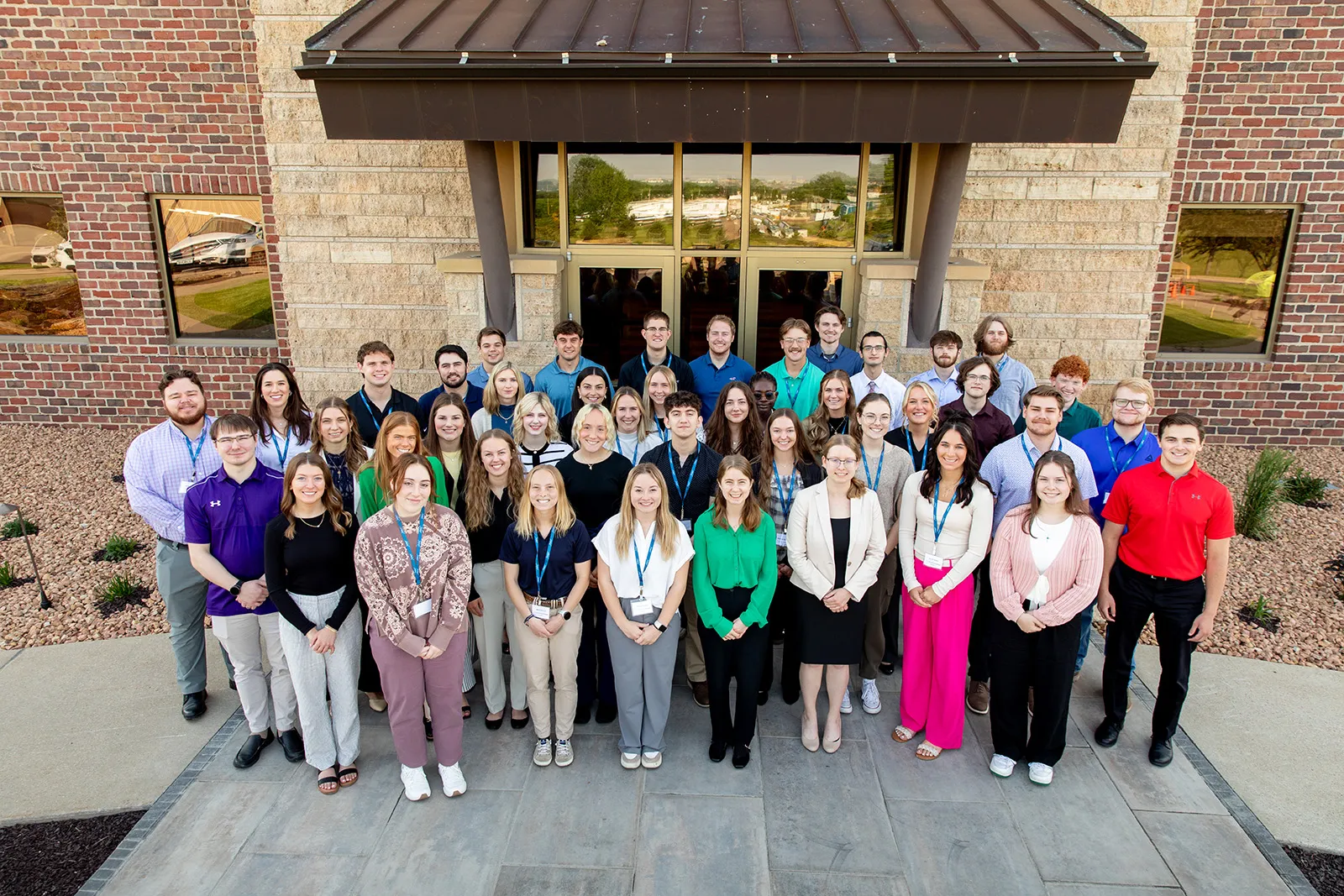 People standing in front of the exterior door 