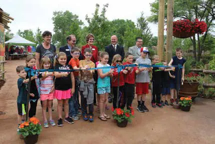 Kids cutting opening ribbon