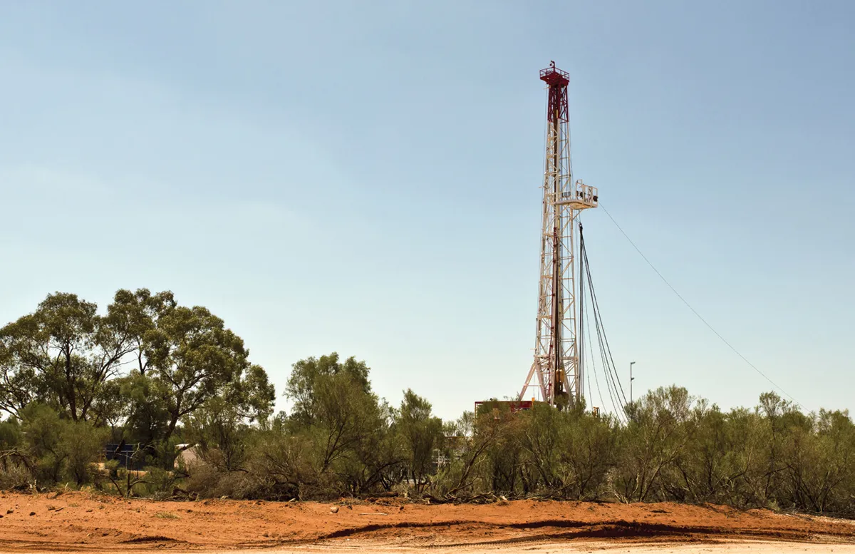 Oil drilling rig in desert landscape