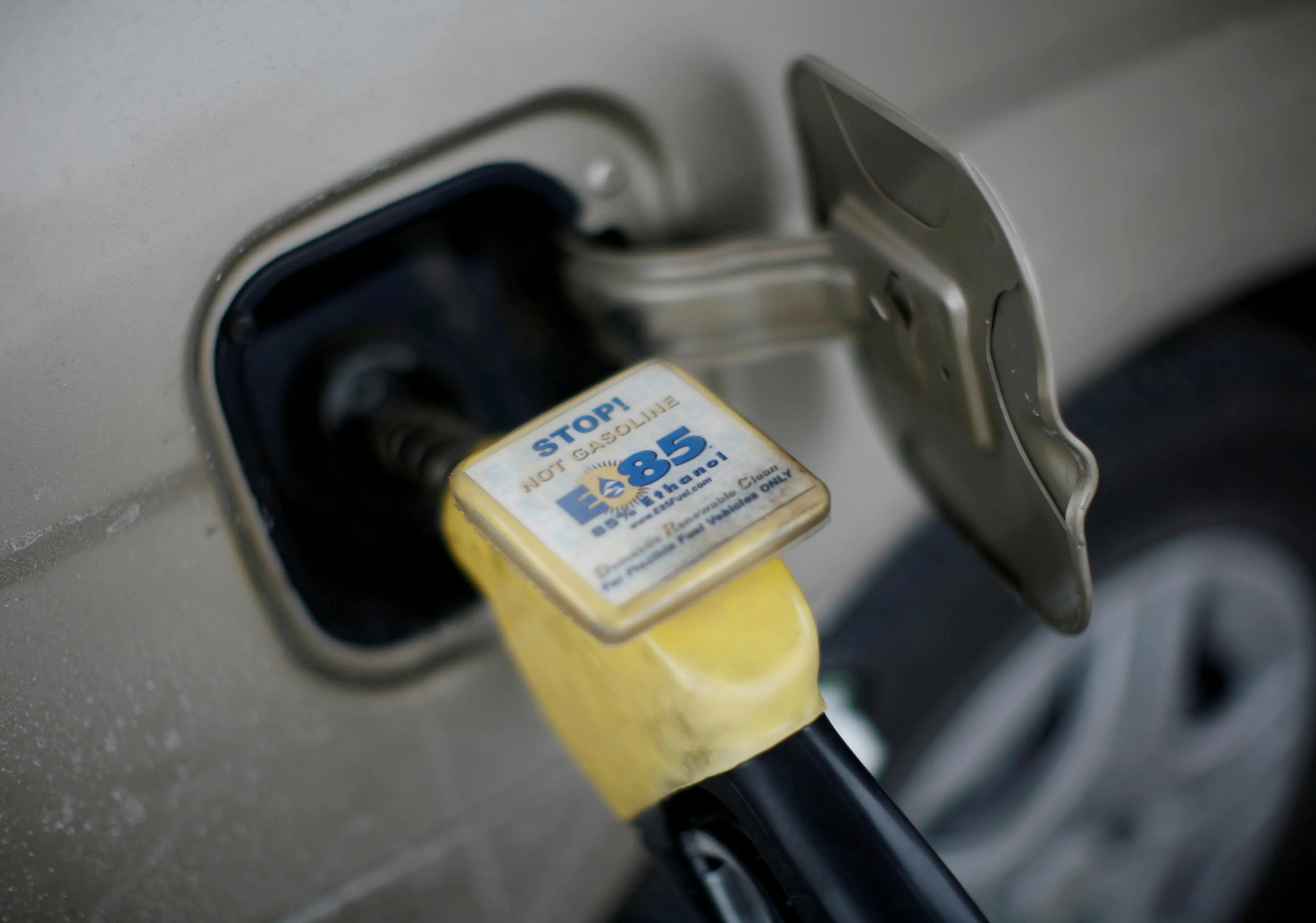 E85 fuel nozzle at car's fuel door