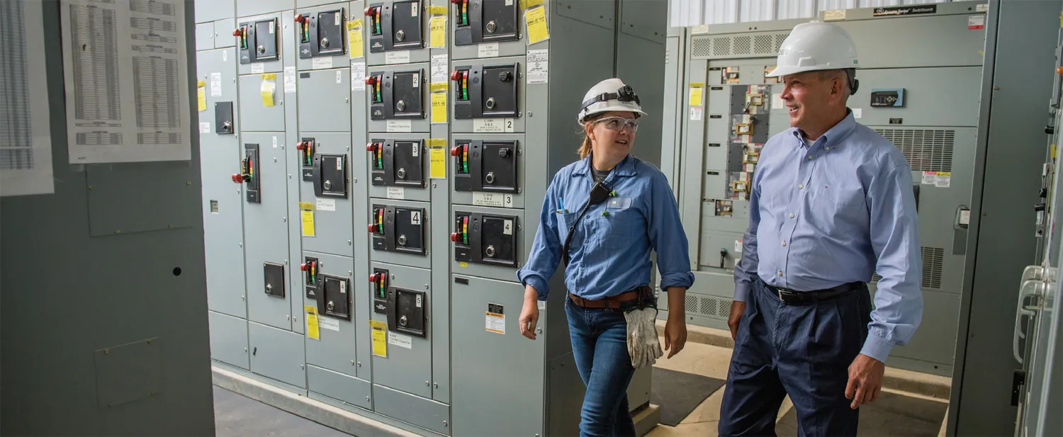 Jim Hill visits with Rachel Kloos, Plant Manager, in the electrical room at POET - Chancellor.