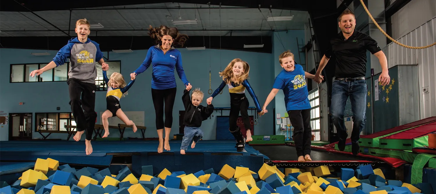 Matt, Alicia and their children playing inside