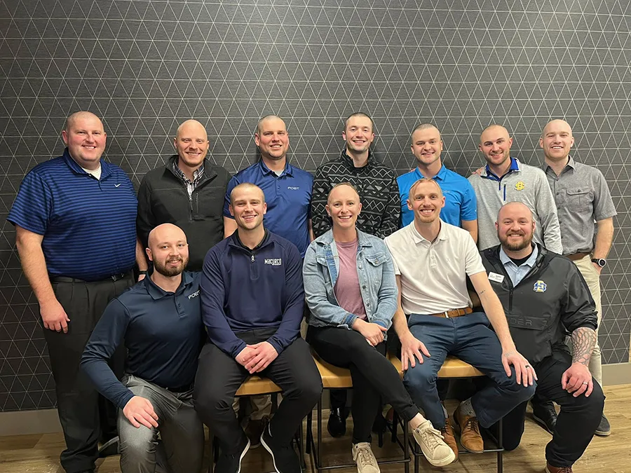Group of coworkers posing for team photo