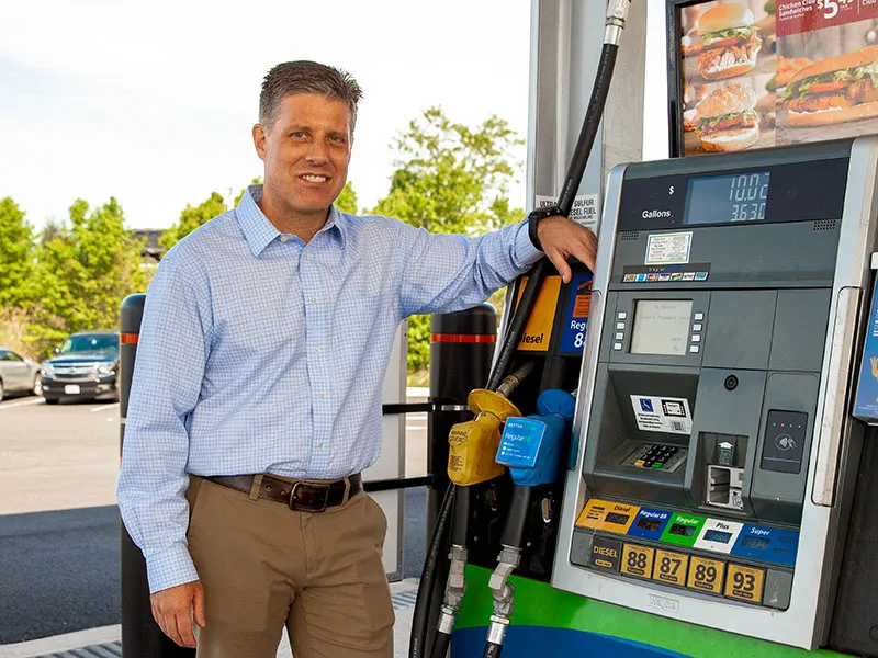 A man by the gas pump