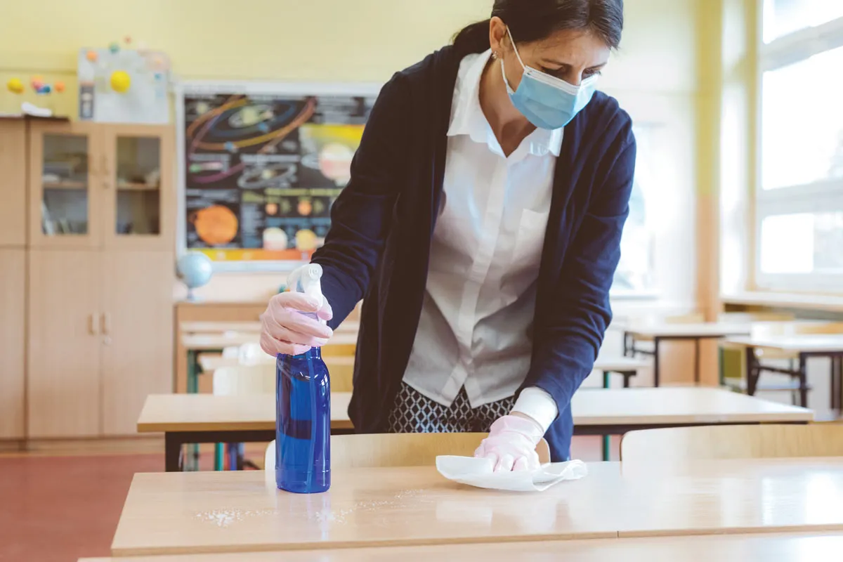 A lady wiping the table