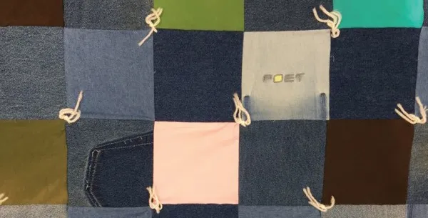 Patchwork denim quilt with knotted ties