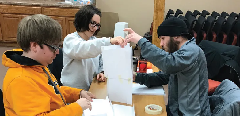 Three people having team activity