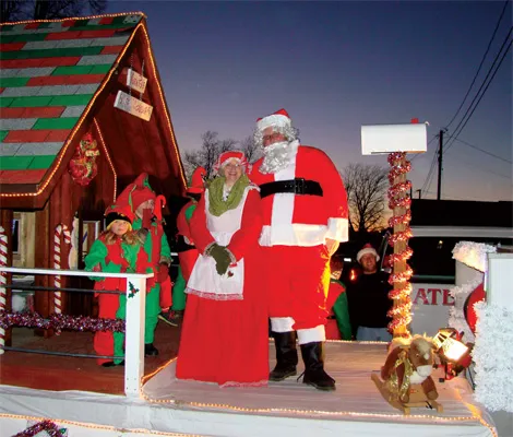 Santa and a woman taking a picture
