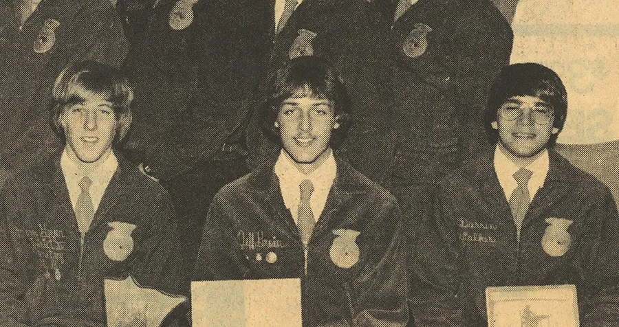 Three students in jackets posing for a photo