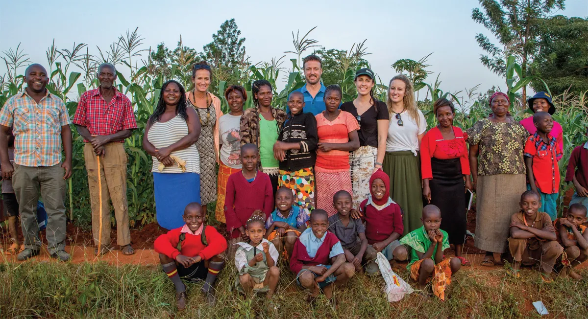 Jeff Broin and family, along with several local farmers, stand in front of one of the fields that has benefitted from Seeds of Change.