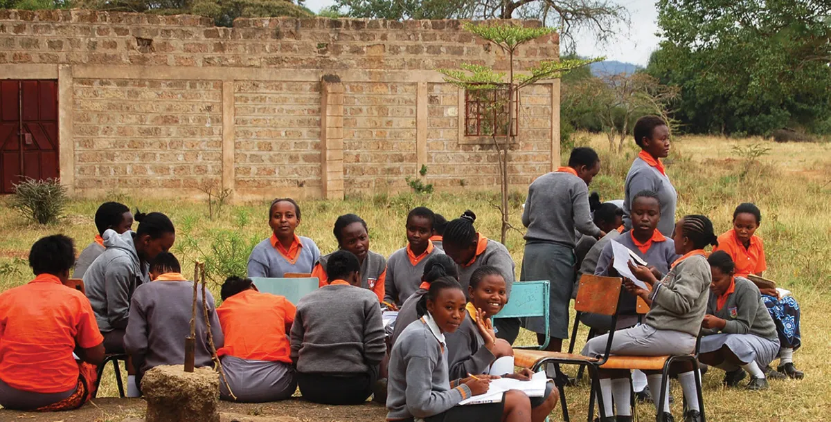 Students sitting outside and studying