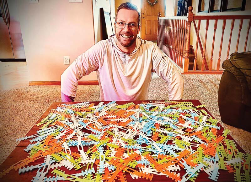Mitchell Olson smiles with 3D printed mask strips donated by Seeds of Change.