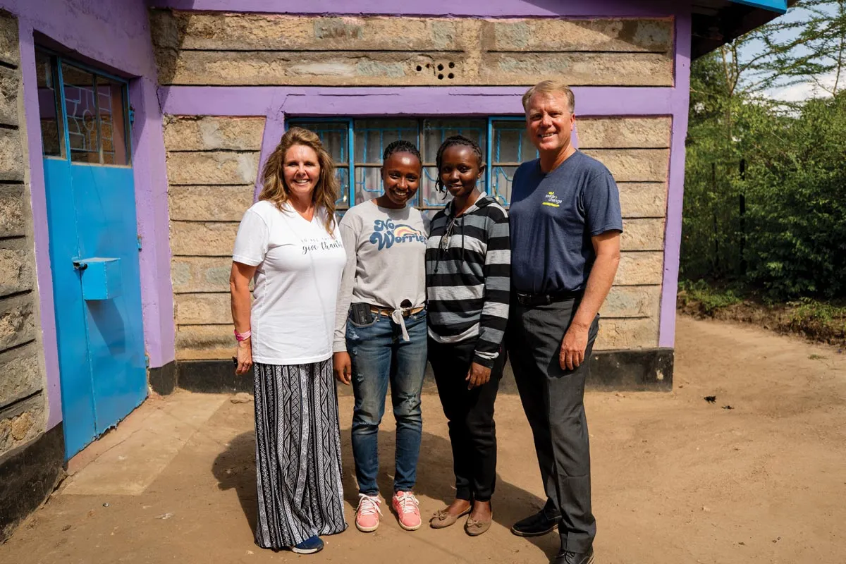 Four people standing outdoor