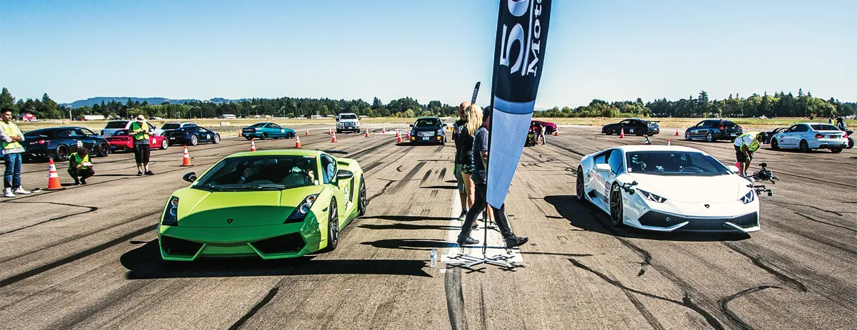 A white and a green race car