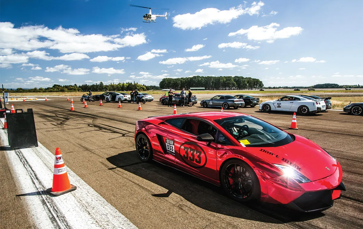 Red sports car with 333 racing number