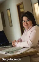 Darcy Anderson at her desk